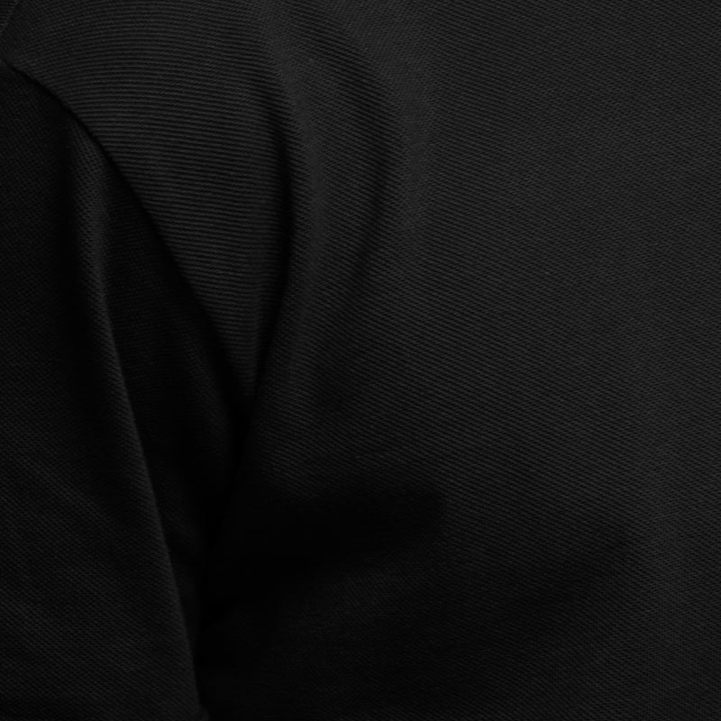 Piqué de coton bio du t-shirt noir à manches courtes Commune Golf, fabrication au Portugal dans un atelier GOTS