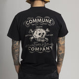 T-shirt noir Commune Golf "Death before layups" en piqué de coton bio, porté par un homme de dos